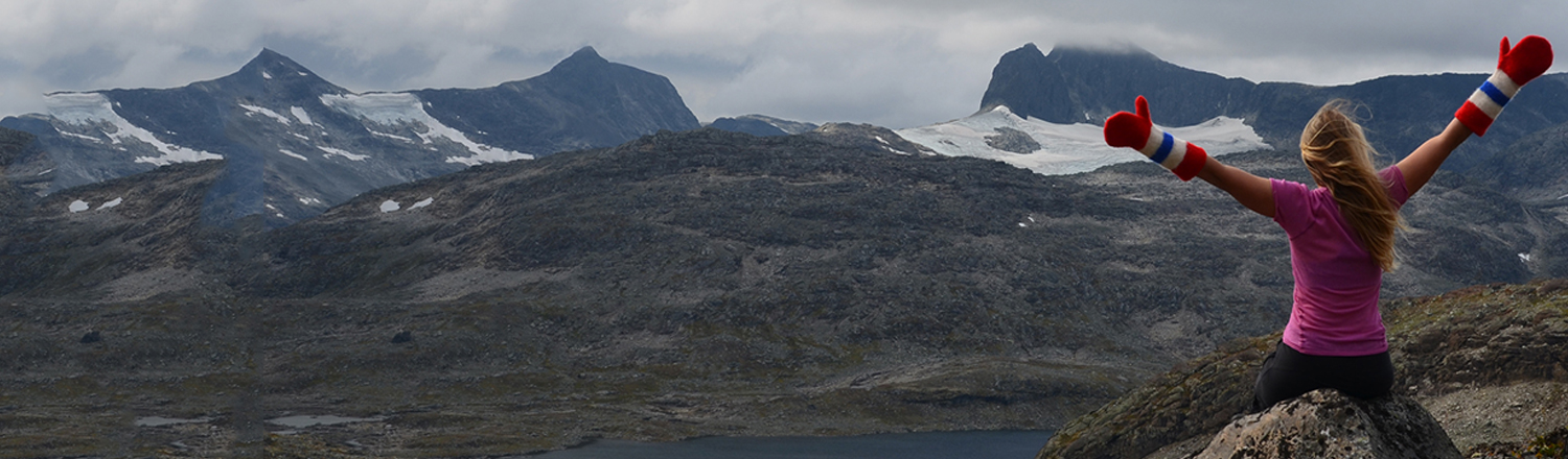 Woman wearing Brynje Clothing looking out onto a mountain